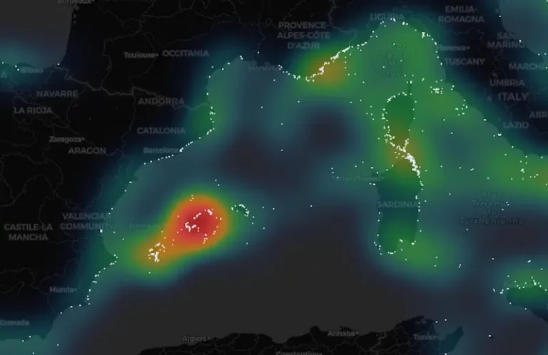 AIS heat map of yacht density in the western Mediterranean, with the densest cluster around Palma de Mallorca inside the 12 August 2026 path of totality