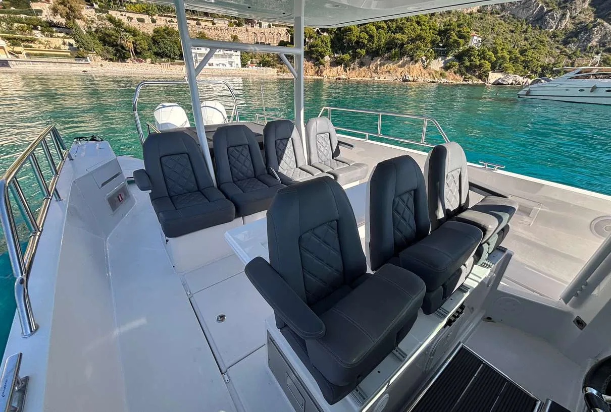 Axopar 37 Sun Top 2020 — cockpit seating looking aft under the sun top