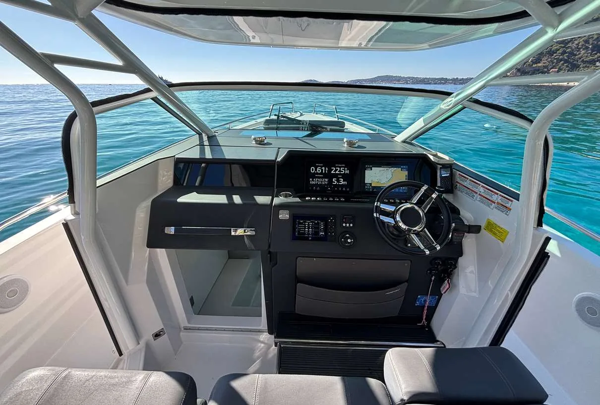 Axopar 37 Sun Top 2020 — helm station with twin Garmin touchscreen displays