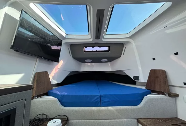 Axopar 37 Sun Top 2020 — forward cabin with double berth and TV
