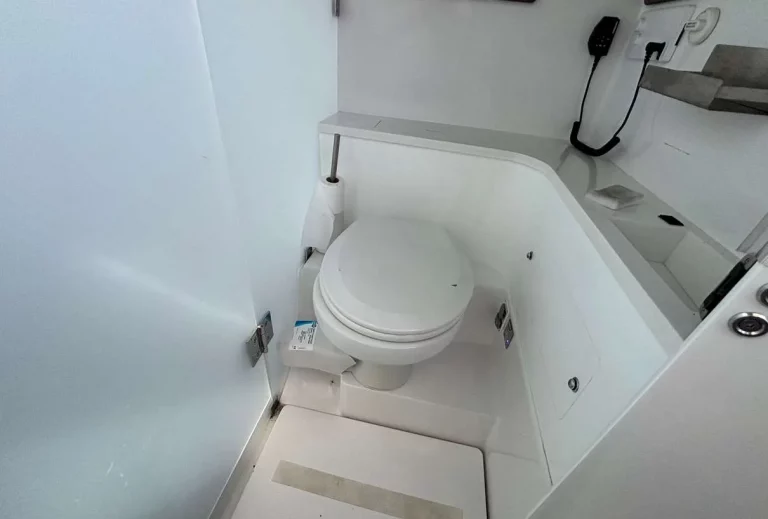 Axopar 37 Sun Top 2020 — separate heads compartment with electric toilet
